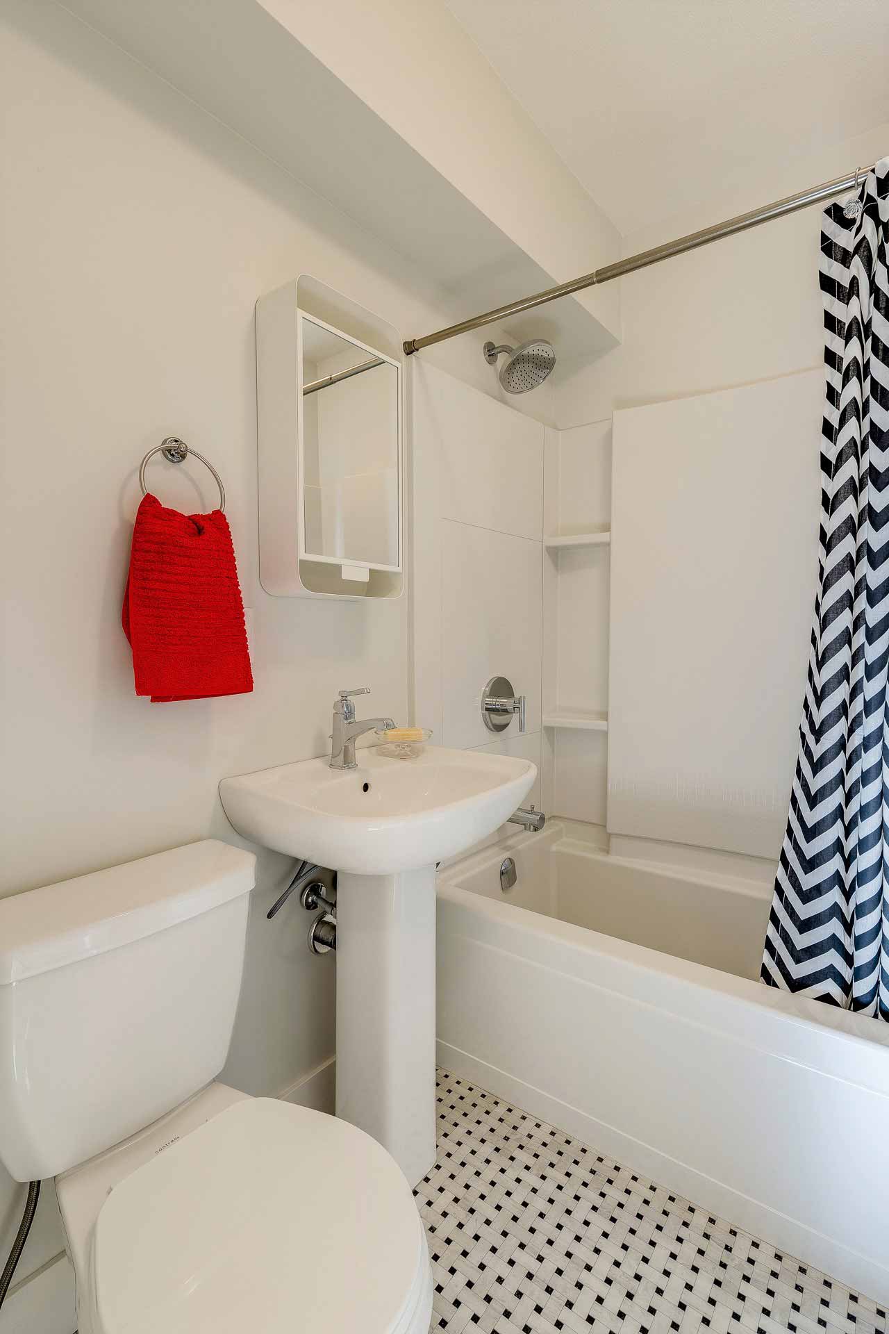 bathroom with red accent